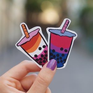 May include: Two bubble tea stickers with a pink, orange, and yellow design and a blue, purple, and pink design.