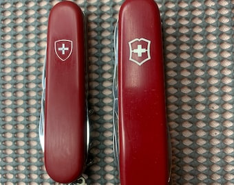 2 couteaux Victorinox Tourist (vieille croix) 84 mm et Huntsman 91 mm