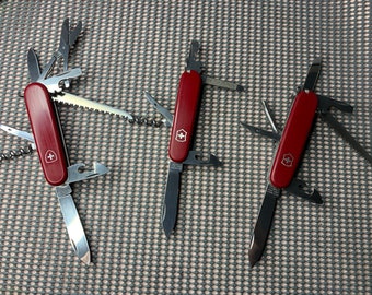 3 knives Victorinox Hiker 91 mm, Huntsman 91 mm old version old stamp and Sportsman 84 mm