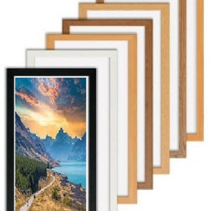 May include: A set of seven picture frames in various wood tones, including black, white, and natural wood. The frames are arranged in a staggered pattern, with the largest frame at the bottom and the smallest frame at the top. The frames are all empty, and the background is white.