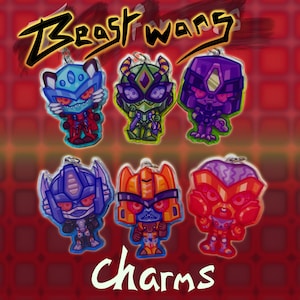May include: Six acrylic charms featuring stylised robot characters from Beast Wars. The characters are depicted in vibrant colours including blue, green, purple, orange, and red. Each charm includes a small metal loop for attachment.