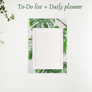 May include: A white to-do list and daily planner with a green tropical leaf design. The planner has a section for "To Do" and a section for "Daily Notes".