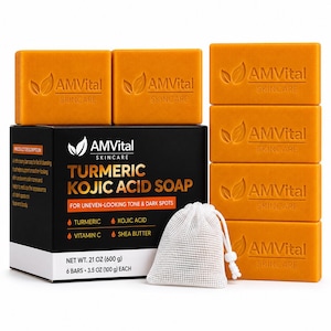 May include: Six rectangular orange bars of AMVital Skincare Turmeric Kojic Acid soap, each embossed with a leaf logo and brand name. The set includes a black product box with white text and a small white mesh drawstring bag for lathering.