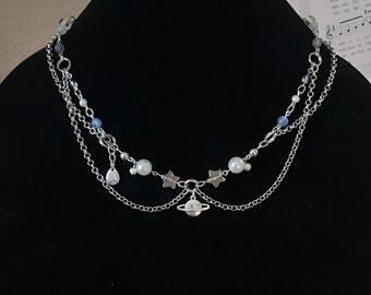 saturn necklace with chains and charms