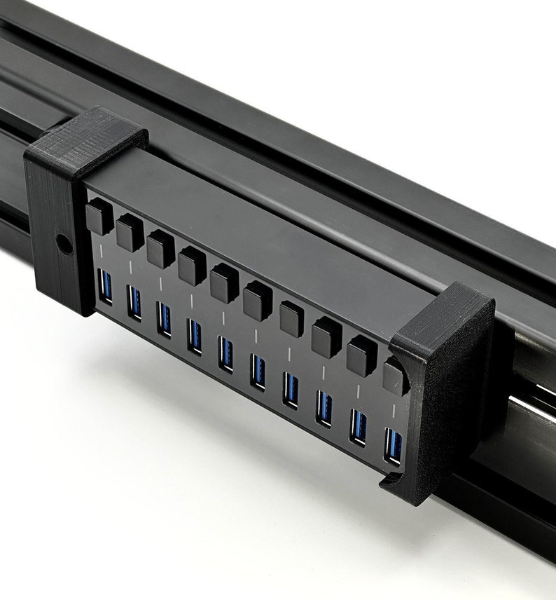 Sim Racing Sabrent USB Hub mount for Aluminium extrusion cockpits. Snug fit, concealed bracket, power LED monitoring. Bolts & Spring TNuts for 40Series Aluminium Cockpits. Compatible with Sabrent 10 ports USB HUB. Great cable management solution!