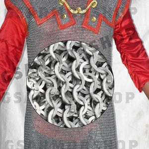 May include: A silver chainmail shirt with red trim. The chainmail is made of interlocking metal rings.