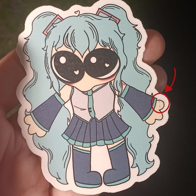 May include: A sticker of a cartoon character with large eyes and blue hair wearing a blue and white dress and black boots. The character is holding out a hand with a heart on the finger.