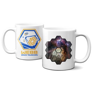May include: Two white ceramic mugs with a design featuring the James Webb Space Telescope. One mug has the telescope's logo with the text "WEBB SPACE TELESCOPE". The other mug has a hexagonal pattern with a colorful nebula image.