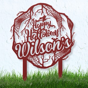 May include: Red metal Halloween garden sign with a spooky tree design and the text "Happy Halloween Wilson's".
