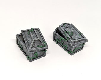 May include: Two gray stone coffins with green vines growing on them. The coffins are open and the lids are propped up.
