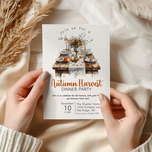 May include: An invitation to an Autumn Harvest Dinner Party. The invitation features a watercolor illustration of a table setting with pumpkins, fall foliage, and a vase of flowers. The text on the invitation reads "Join us for an Autumn Harvest Dinner Party" and includes the date, time, location, and RSVP information.