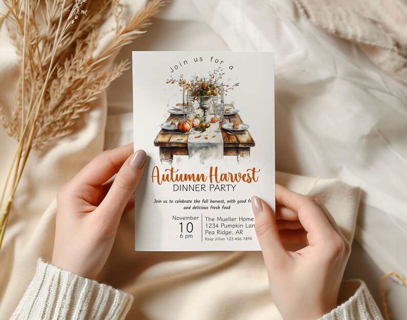 May include: An invitation to an Autumn Harvest Dinner Party. The invitation features a watercolor illustration of a table setting with pumpkins, fall foliage, and a vase of flowers. The text on the invitation reads "Join us for an Autumn Harvest Dinner Party" and includes the date, time, location, and RSVP information.