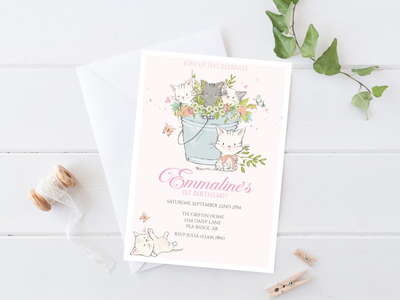 May include: Pink and white invitation with a cartoon illustration of four kittens in a bucket of flowers. The text reads "Join us to celebrate Emmaline's 1st Birthday!"  Saturday, September 22nd 2PM, The Griffin Home, 1234 Daisy Lane, Pea Ridge, AR, RSVP Julia 1234567890.