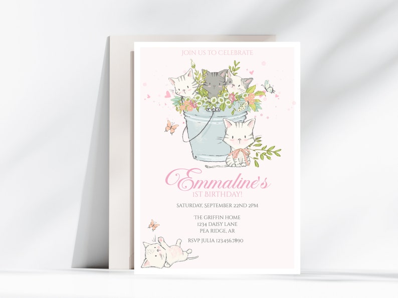 May include: A pink and white invitation with a cartoon illustration of four kittens in a blue bucket with flowers. The text reads "Join us to celebrate Emmaline's 1st Birthday! Saturday, September 22nd 2PM The Griffin Home 1234 Daisy Lane Pea Ridge, AR RSVP Julia 1234567890"