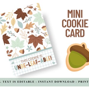 May include: A printable mini cookie card with a fall theme. The card features a pattern of brown, green, and tan leaves, acorns, and flowers. Text on the card reads "This cookie is UNBE-LEAF-ABLE!" An acorn cookie graphic is also shown.