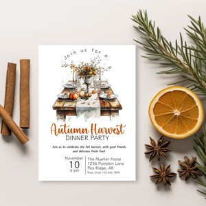 May include: An invitation to an Autumn Harvest Dinner Party. The invitation features a watercolor illustration of a rustic table setting with pumpkins, fall foliage, and place settings. The text reads "Join us for Autumn Harvest Dinner Party" and includes the date, time, and location of the event.