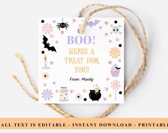 May include: A square Halloween gift tag with a light purple and gold color scheme. The tag features the text "BOO! Here's a treat for you!" and is decorated with Halloween-themed illustrations, including a spider, bat, and candy. The tag is tied with twine.