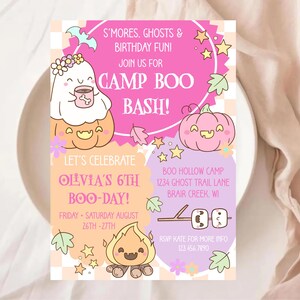 May include: A colourful invitation for a Camp Boo Bash birthday party. The design includes cartoon ghosts, pumpkins, stars, and a campfire. The text reads "S'mores, Ghosts & Birthday Fun!" and "Olivia's 6th Boo-Day!"