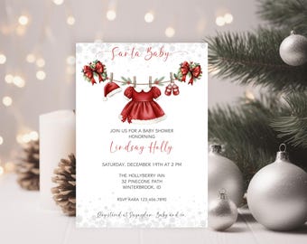 May include: A baby shower invitation with a Christmas theme. The invitation features a red Santa hat, dress, and baby shoes hanging on a clothesline. The text reads "Santa Baby" and invites guests to a baby shower honoring Lindsay Holly.