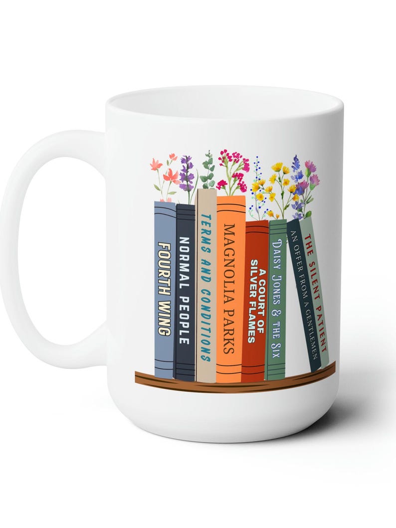 White 15 oz mug with seven books on a shelf with wildflowers for bookmarks. Book titles can be customized to a person's favorite books.