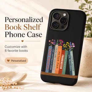 May include: A black smartphone case featuring a graphic of a wooden shelf holding six colorful book spines titled Dark Princess, Lady Chatterley's Lover, Peter Pan, Frankenstein, Orlando, and Les Miserables, with small floral sprigs tucked behind them.