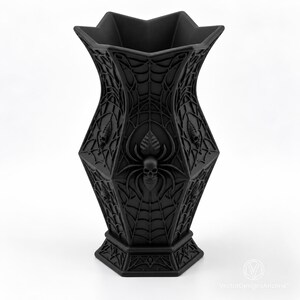 Noctara matte-black 3D-printed gothic spiderweb skull dry vase on a clean studio background.