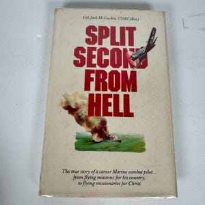 May include: A vintage book cover for "Split Second From Hell", featuring bold red lettering and an illustration of a plane and explosion. The cover includes the author's name and a brief synopsis of the book's story.