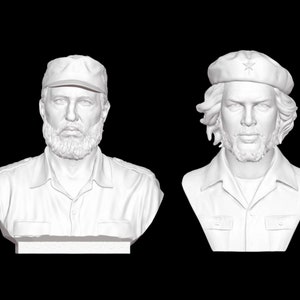 May include: Two white plaster busts of famous Cuban revolutionaries. The bust on the left is of Fidel Castro, wearing a cap. The bust on the right is of Che Guevara, wearing a beret with a star.
