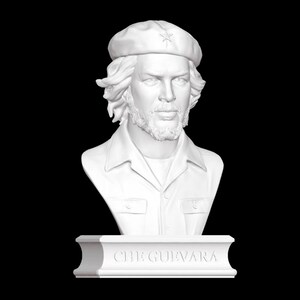 May include: White bust sculpture of Che Guevara wearing a beret with a star on it. The bust is on a white base with the inscription "CHE GUEVARA".