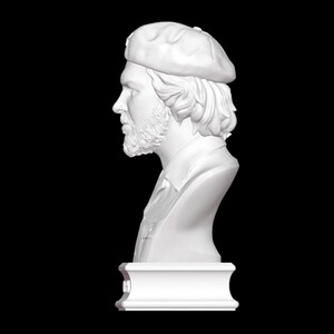 May include: White plaster bust sculpture of a man wearing a beret. The bust is on a white pedestal.