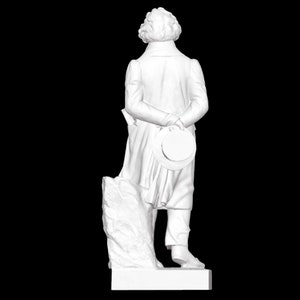 May include: White marble statue of a man standing on a plinth. The man is wearing a long coat and has his hands behind his back. He is holding a hat in his right hand.