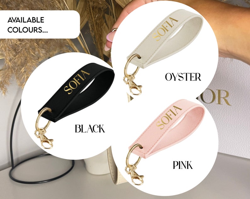 May include: Three leather keychains with gold metal rings and the name "Sofia" in gold lettering. The keychains are in black, oyster, and pink.