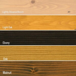 May include: Five wood samples showing different wood stains: Lightly Steamed Beech, Light Oak, Ebony, Oak, and Walnut.