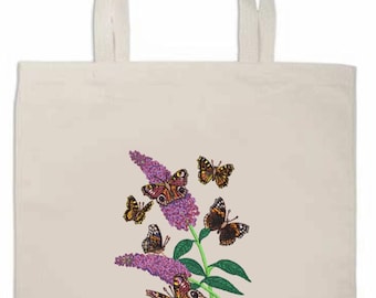 May include: Cream-colored tote bag featuring a purple flower with green leaves and several butterflies. The butterflies have brown and orange wings with black markings. The bag has two handles for carrying.