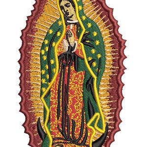 May include: Embroidered image of Our Lady of Guadalupe. The figure is depicted in a green robe with gold stars, a red and gold patterned dress, and a yellow halo. The image is framed by a burgundy scalloped border.