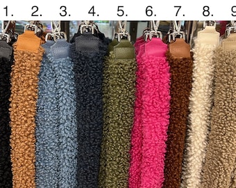 May include: Nine different colors of fuzzy fabric straps, numbered 1 through 9.