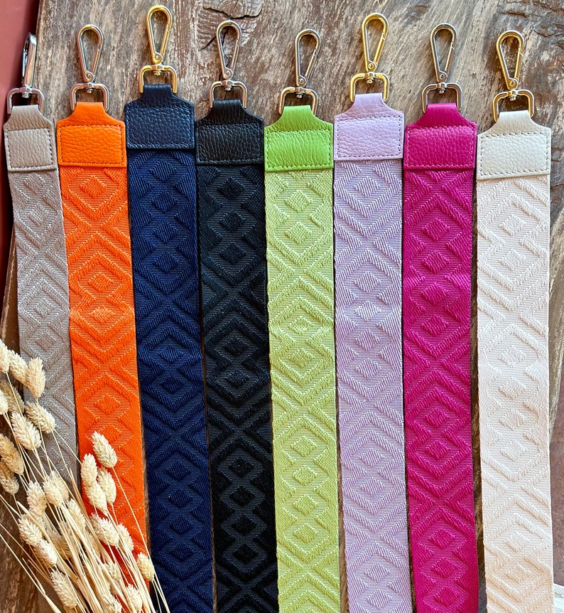 May include: Nine different colored woven straps with silver clasps. The straps are all the same width and have a geometric pattern.