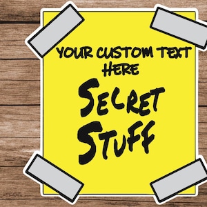 May include: A yellow sticky note with black tape on the corners. The note says "YOUR CUSTOM TEXT HERE SECRET STUFF".