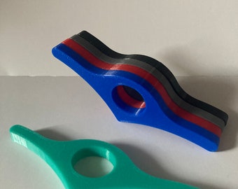 One handed book aid/holder