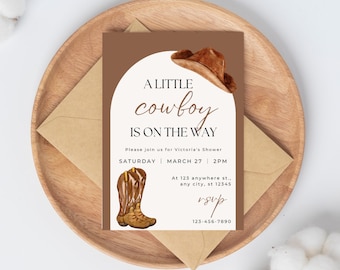May include: A baby shower invitation with a cowboy theme. The invitation features watercolor illustrations of a cowboy hat and boots, with the text "A little cowboy is on the way." The invitation is on a brown background.