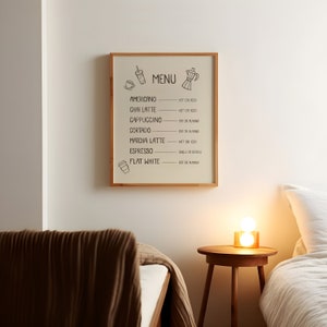 Art print of a drink menu. The list of drinks include; americano, chai latte, cappuccino, cortado, matcha latte, espresso, and flat white. The options next to each drink are; hot or iced, oat milk or almond milk, and single or double.