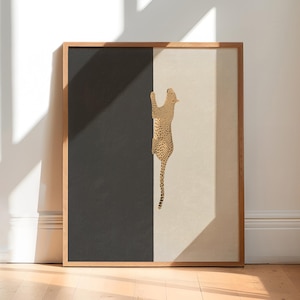 Hand drawn art print of a cheetah climbing vertically in the center of the print. The left side of the print is sold dark grey and the right side is a light tan/beige color.