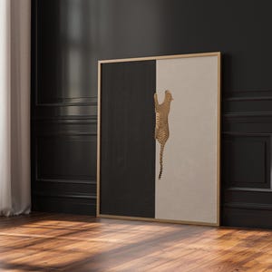 Hand drawn art print of a cheetah climbing vertically in the center of the print. The left side of the print is sold dark grey and the right side is a light tan/beige color.