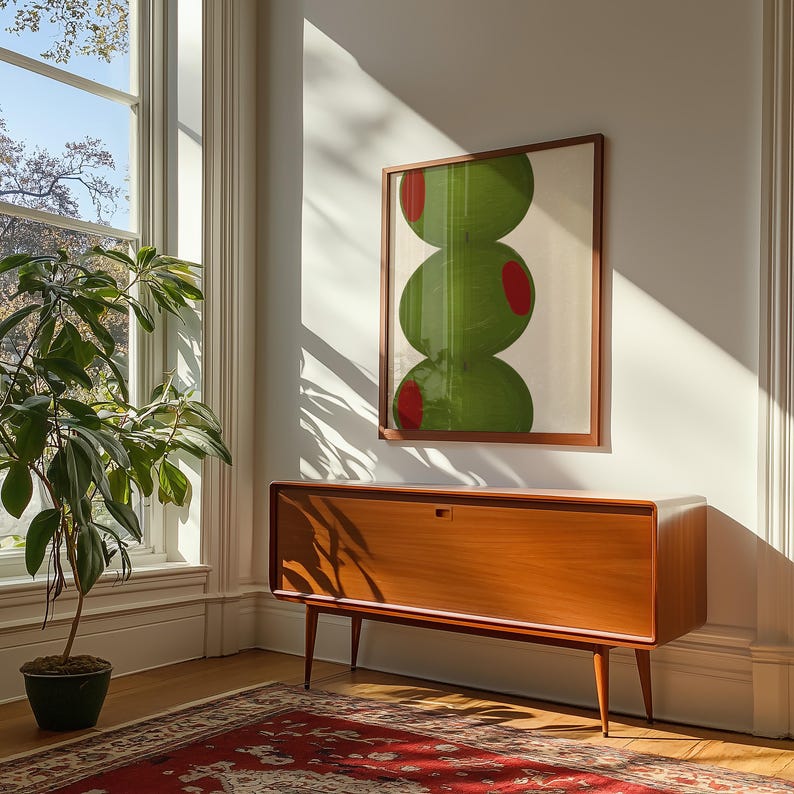 Hand drawn art print of three large olives off center to the left.