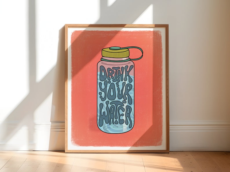 Art print of a water bottle that has the works "drink your water" on it in blue. The water bottle lid is green and the background is salmon pink.