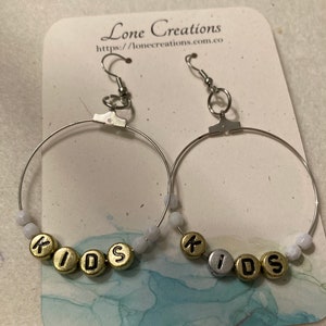 Silver “Kids” hoop earrings