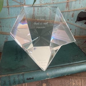 May include: A set of three ceramic mugs with a speckled, matte finish. The mugs are in shades of cream, light gray, and dark gray. Each mug has a simple, minimalist design and a rounded handle.