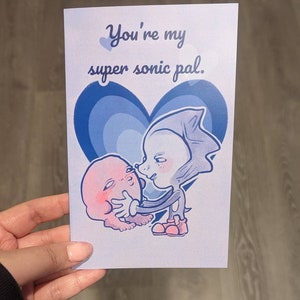 Carte de voeux Supersonic Pal Hérisson bleu et rond rose Personnages de jeux vidéo Amitié Saint Valentin mème maudit