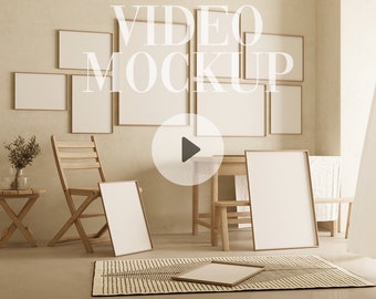 May include: A living room interior with a beige wall and a wooden table with chairs. There are several empty picture frames on the wall and a rug on the floor. The text "VIDEO MOCKUP" is superimposed on the image.