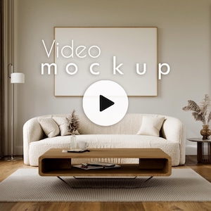 May include: A living room scene with a large white framed video mockup above a cream-colored sofa. A wooden coffee table sits in front of the sofa, and a rug is on the floor. The words "Video mockup" are displayed on the image.